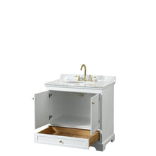 Load image into Gallery viewer, Wyndham Collection WCS202036SWGCMUNOMXX Deborah 36 Inch Single Bathroom Vanity in White, White Carrara Marble Countertop, Undermount Oval Sink, Brushed Gold Trim, No Mirror